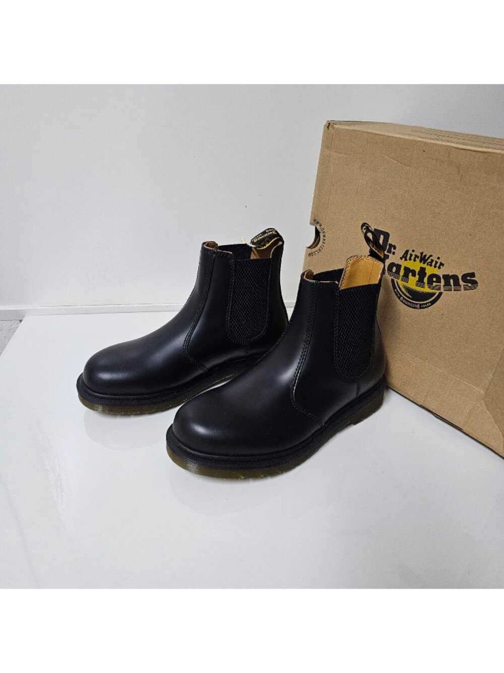 Dr. Martens 2976 Chelsea Boots, featuring black leather and the brand's signatur